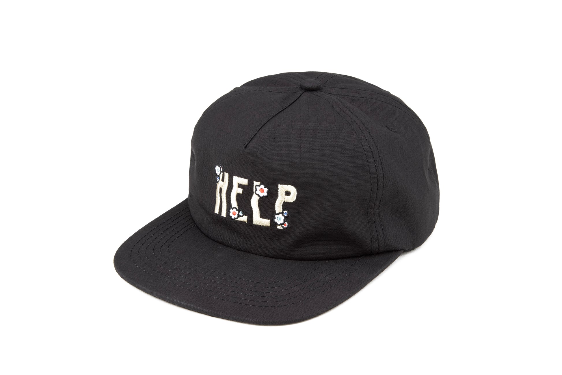 Black 5 panel hat with an embroidered design that says "Help" on the front. The design includes flower embroidery on top of each letter. The material is ripstop cotton.